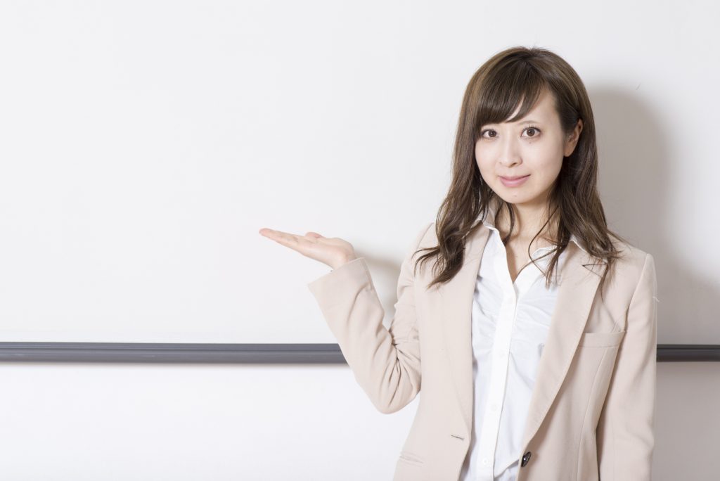 Japanese woman having a seminar in a class room