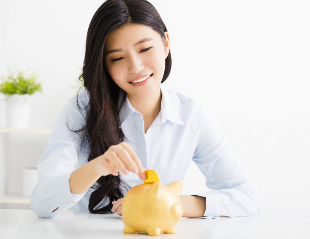 young business woman with piggybank