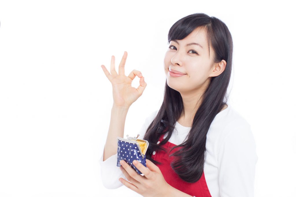 Japanese woman holding a purse making gestures